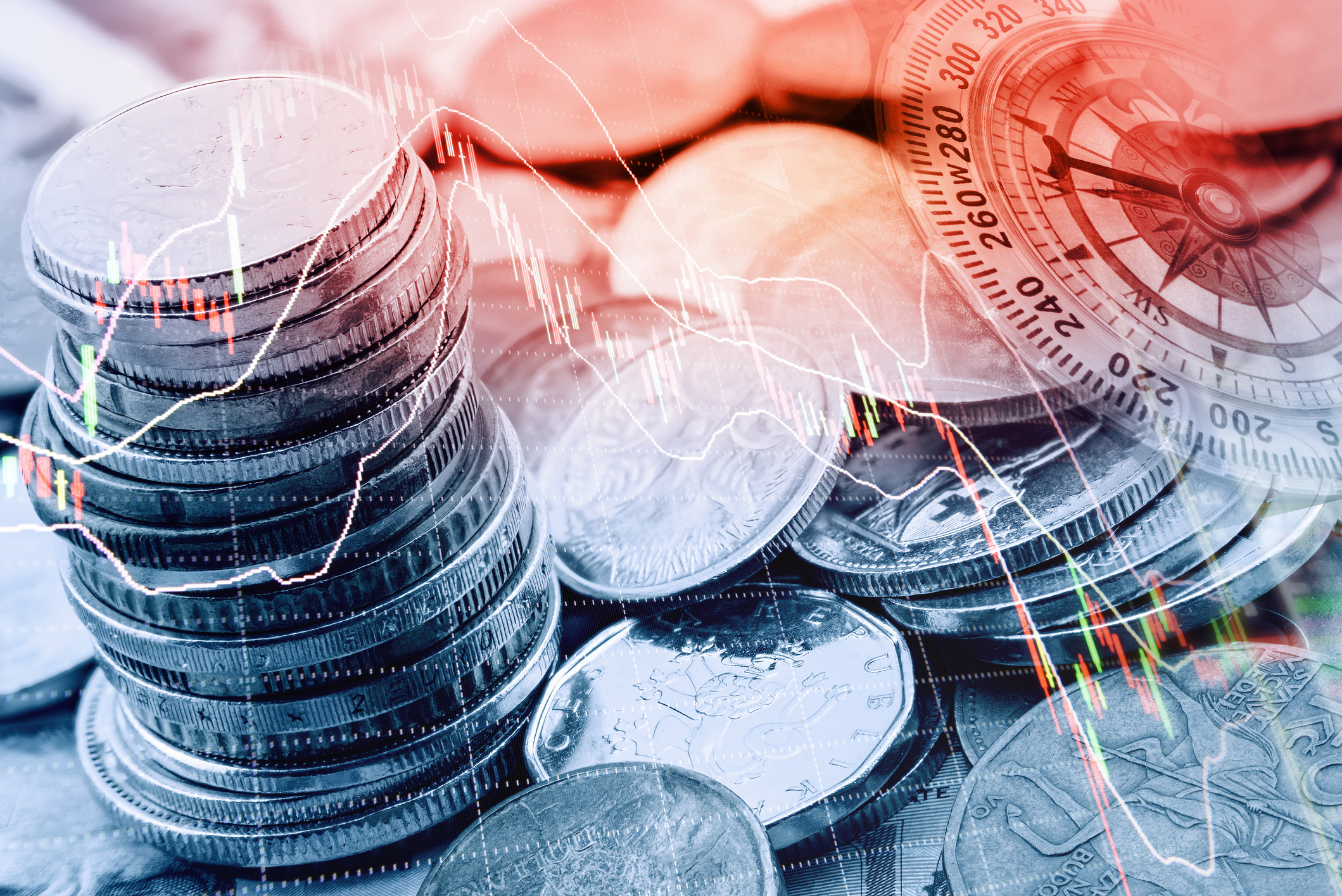 Coins with stock chart laid over them