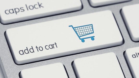 A button on a keyboard that says add to cart.
