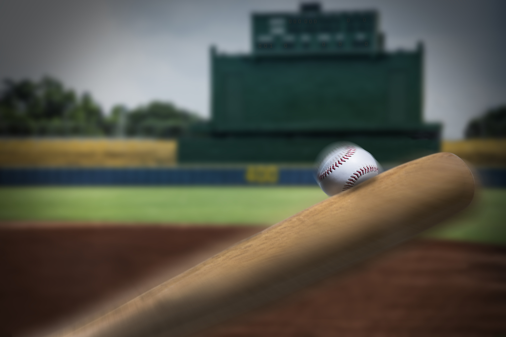 Baseball bat hitting a ball.
