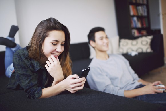 Mobile Phone And Gaming Young Man And Woman