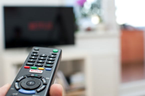 Remote control pointing toward television screen