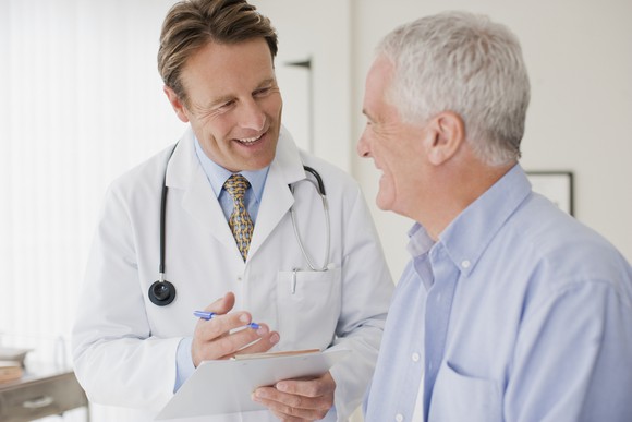 Doctor With Elderly Patient Medicare Getty