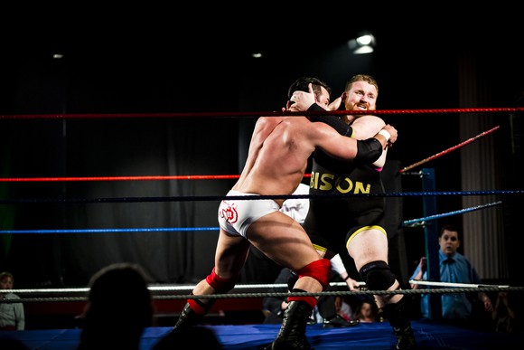Two wrestlers in the ring.