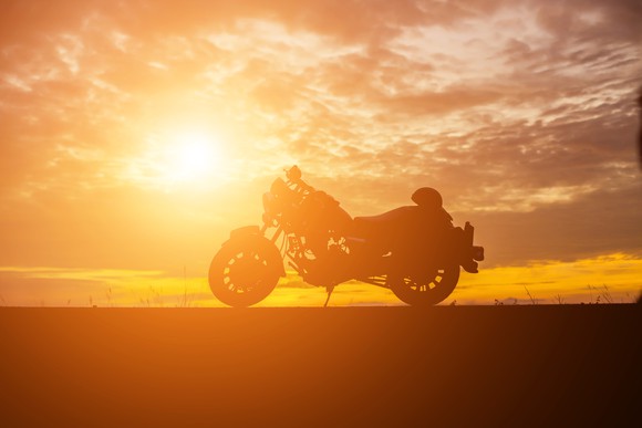 Silhouette of motorcycle at sunset