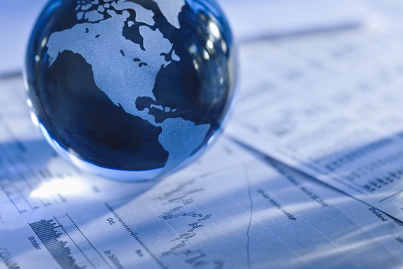 A representation of the world on top of a balance sheet, representing MasterCard's global reach.