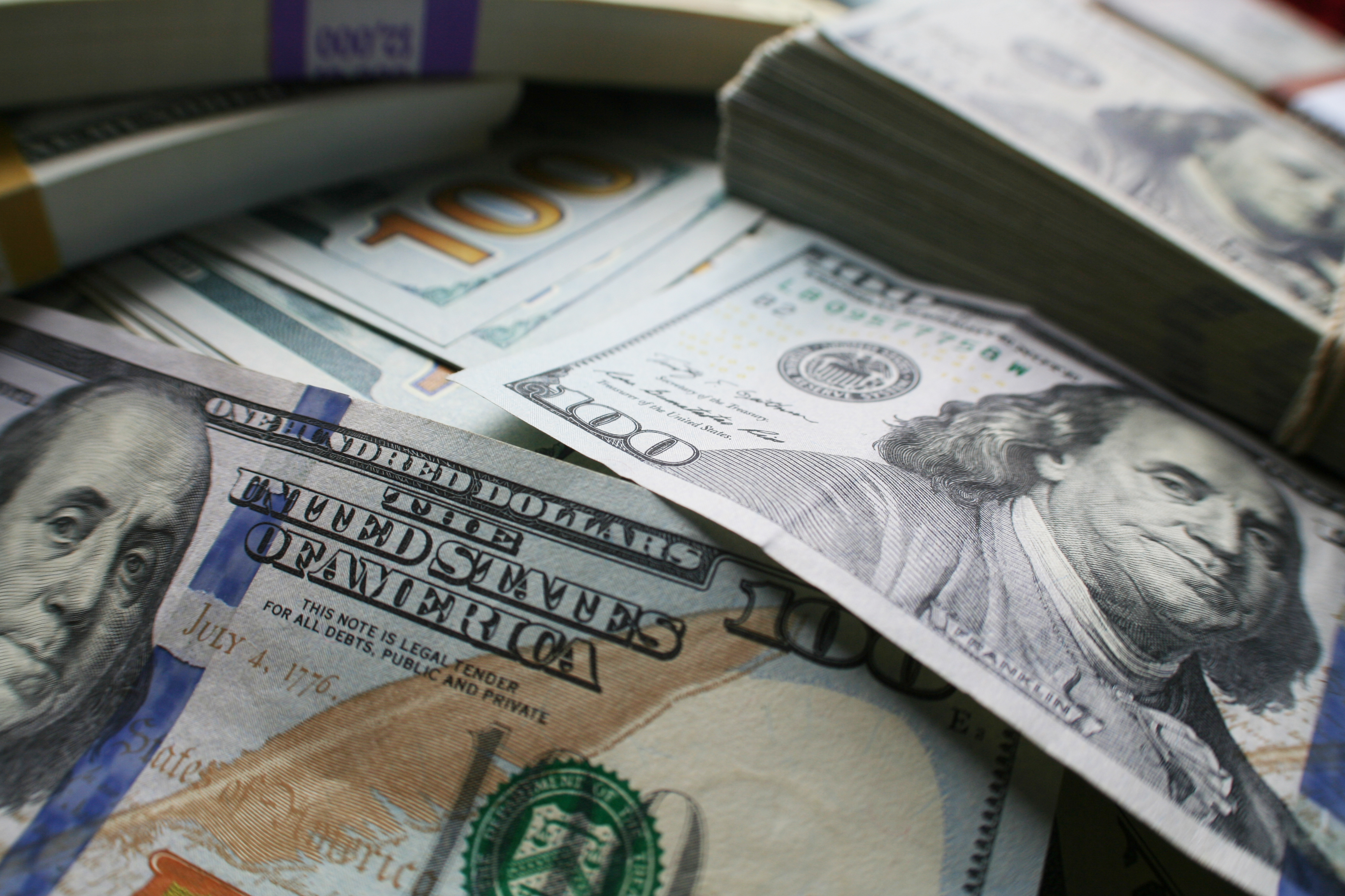 A pile of $100 bills