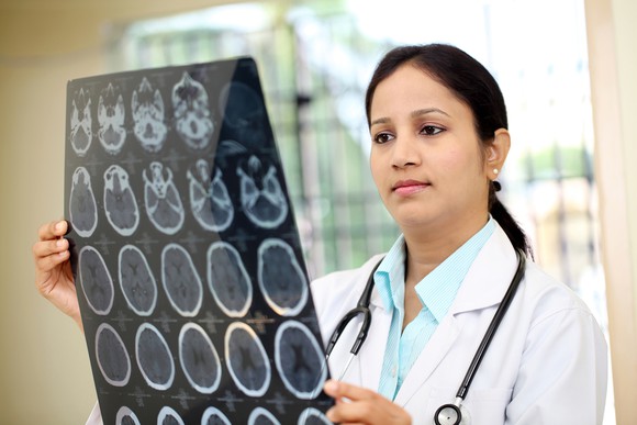 Female Doctor Examining Brain Xrays Cancer Getty