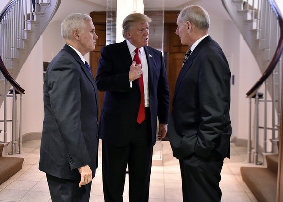 President Trump having a discussion with VP Mike Pence and Secretary of Homeland Security John Kelly.