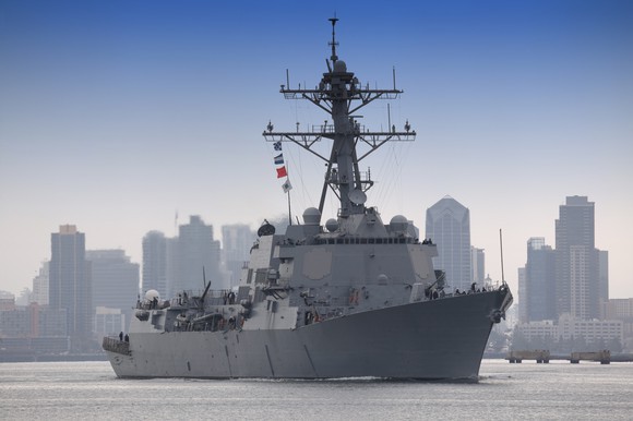 A Navy ship leaving port.