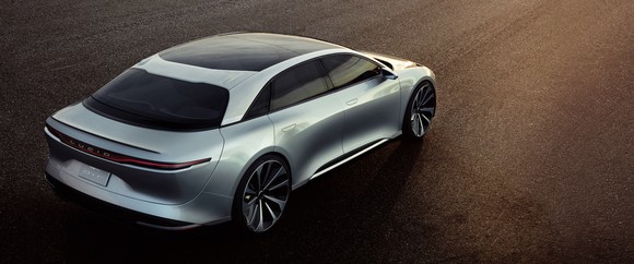 Back, side view of sedan.