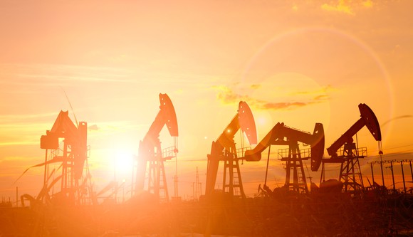 Oil rigs at sunset