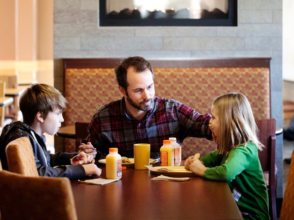 Family enjoying a meal at Panera Bread.