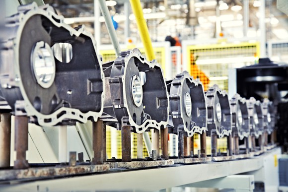 Engines being manufactured in a factory.
