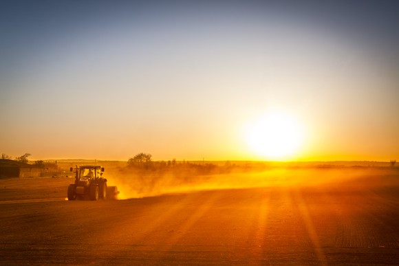 Picture of tractor on farm at sunset