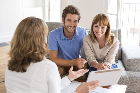 A couple talking to a financial planner