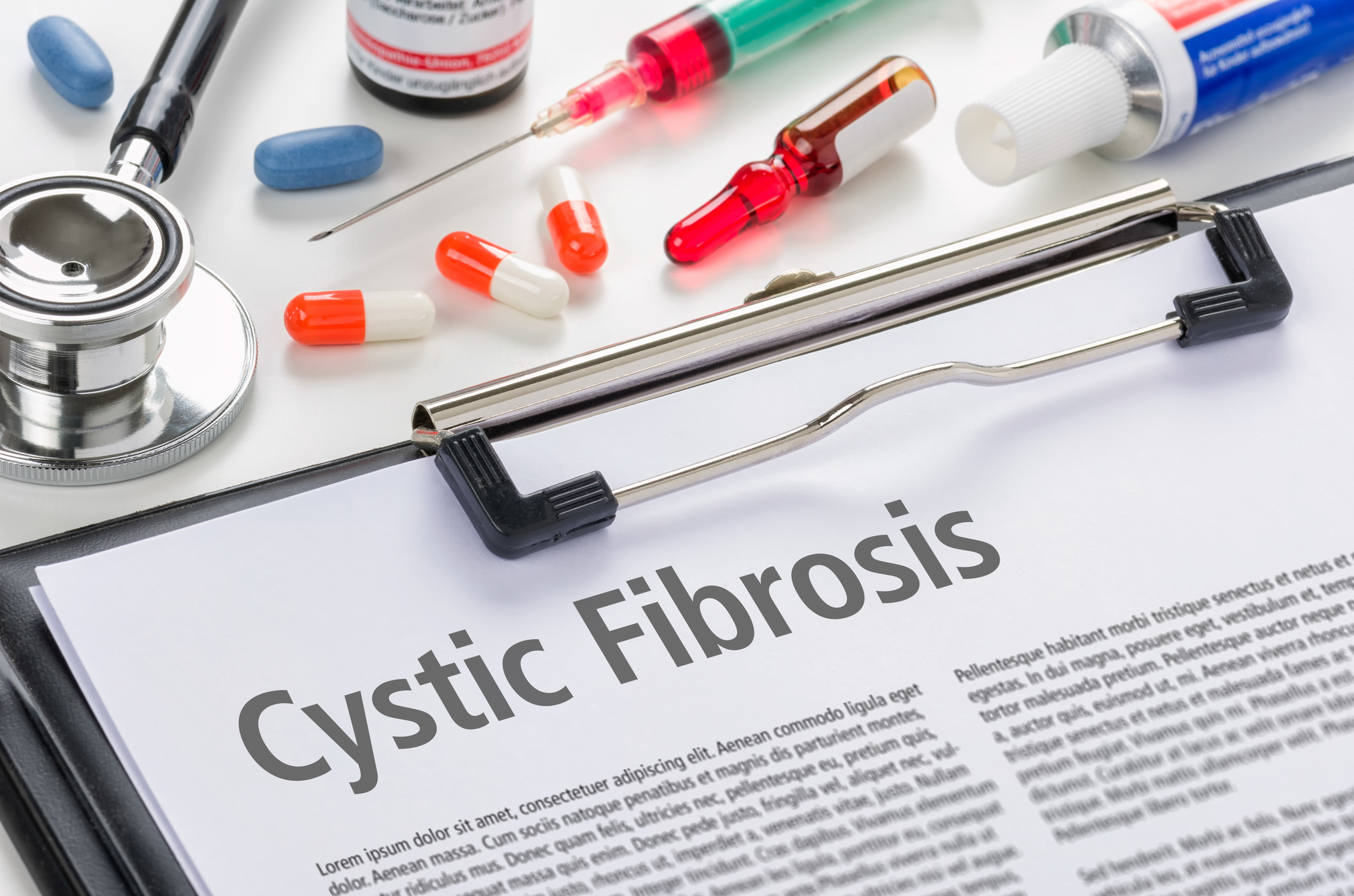 Clipboard with a piece of paper titled cystic fibrosis.