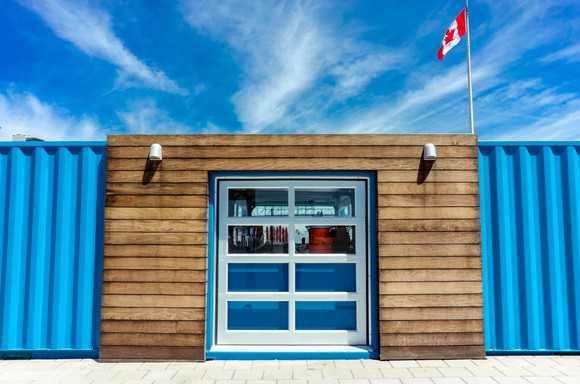 A temporary building under a blue sky.