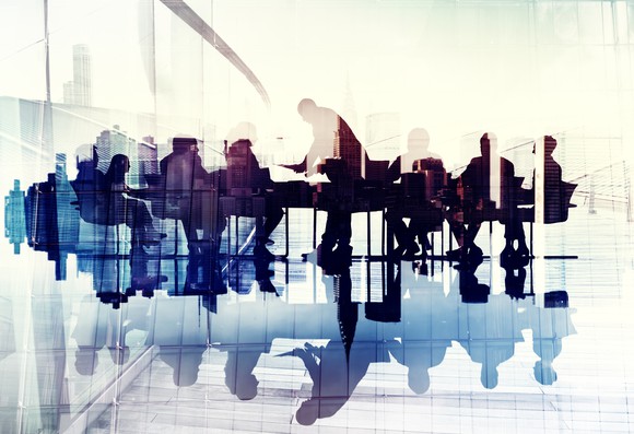 Workers sitting around a conference table