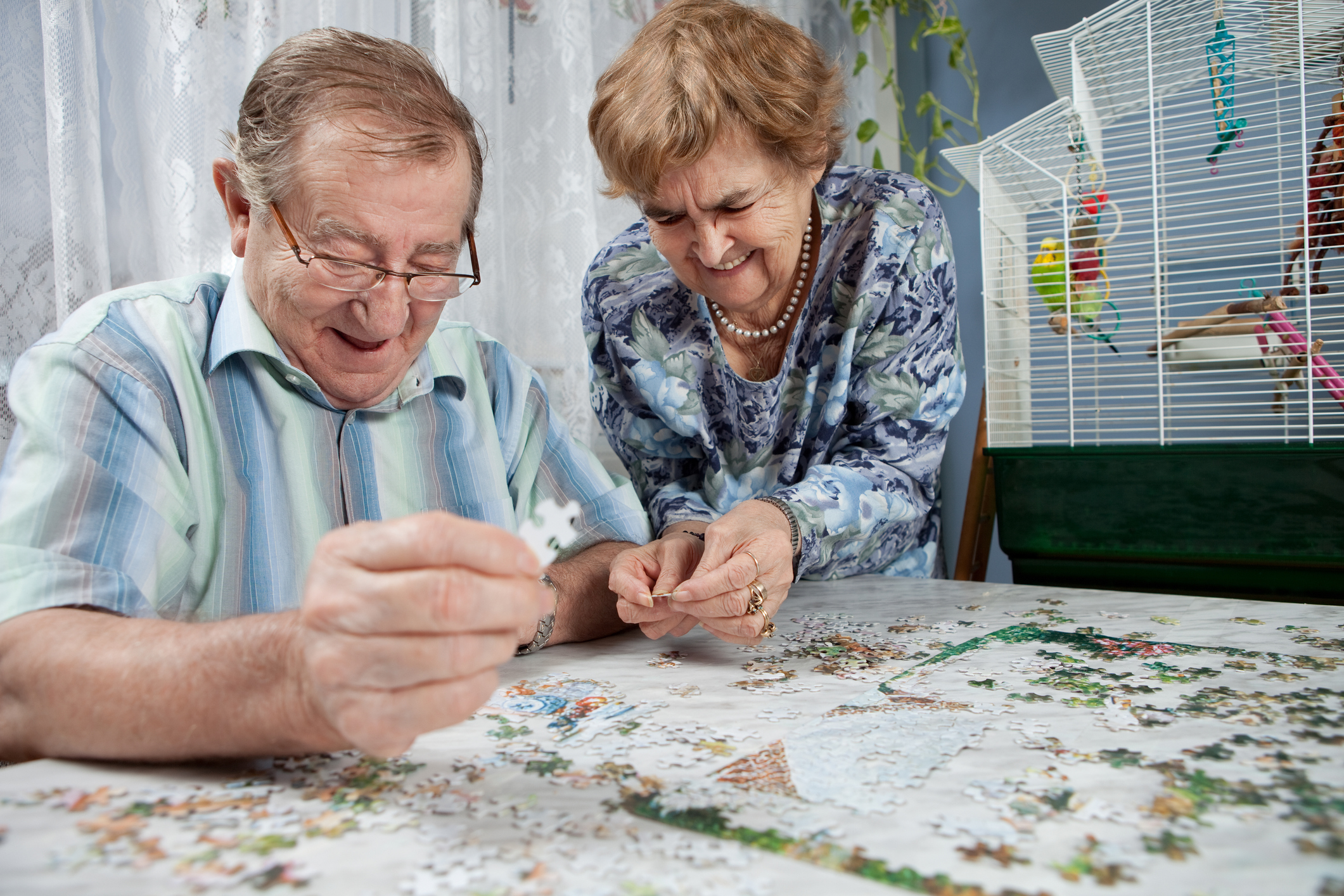 Retired couple working on a puzzle