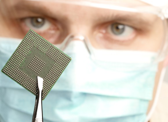 Worker holding a semiconductor chip