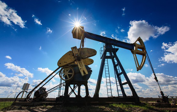Oil Pump with partly cloudy skies.
