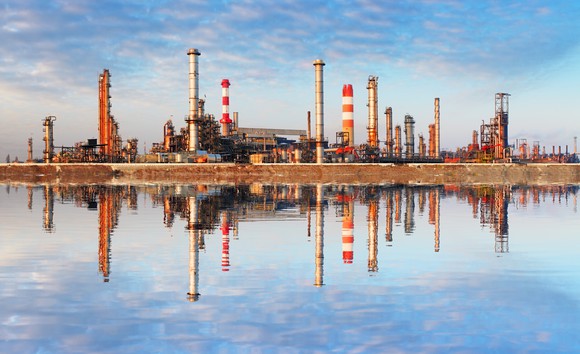 A refinery reflecting off water