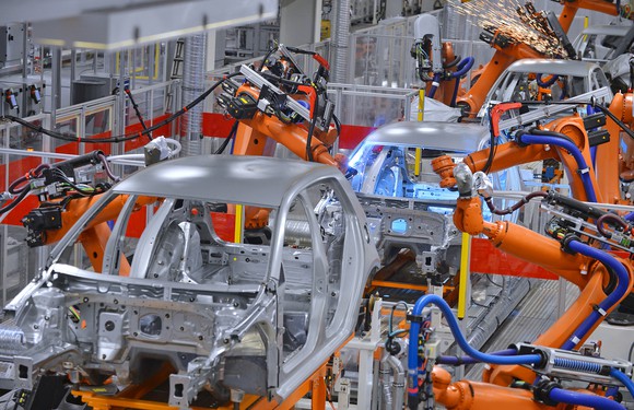 Robots welding in an automobile factory.