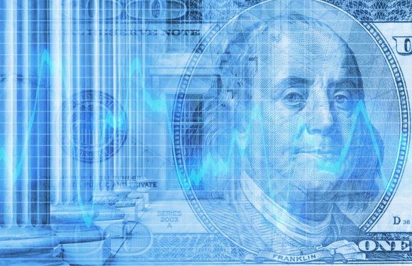 One-hundred dollar bill and stock market chart
