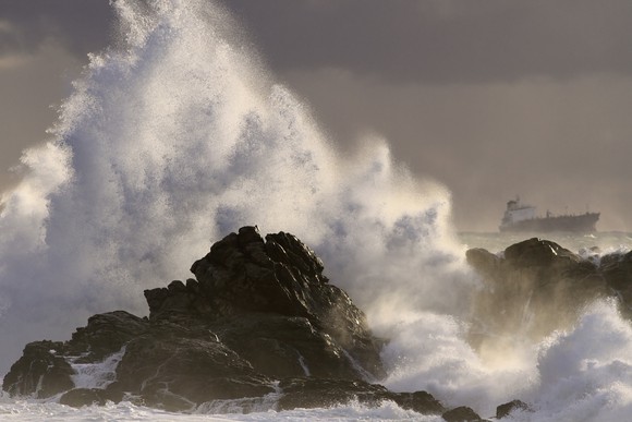 Sea storm at sunset.