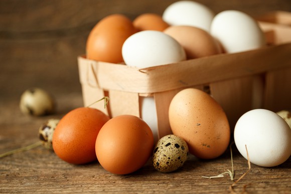 A basket of eggs in multiple colors