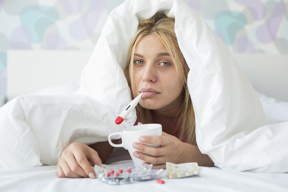 Woman sick in bed