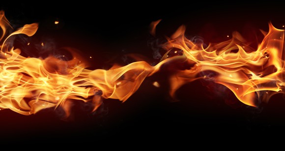 A flame burning across a black background.
