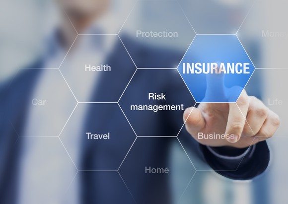 Insurance and related terms on a glass window.