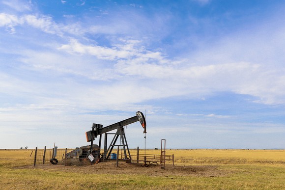 An oil derrick operating on the plains of the Oklahoma panhandle