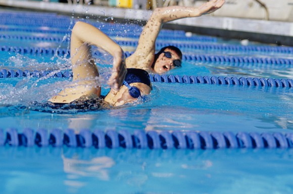 Two female swimmers racing in pool