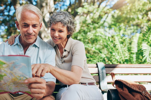 Retired couple sitting outdoors