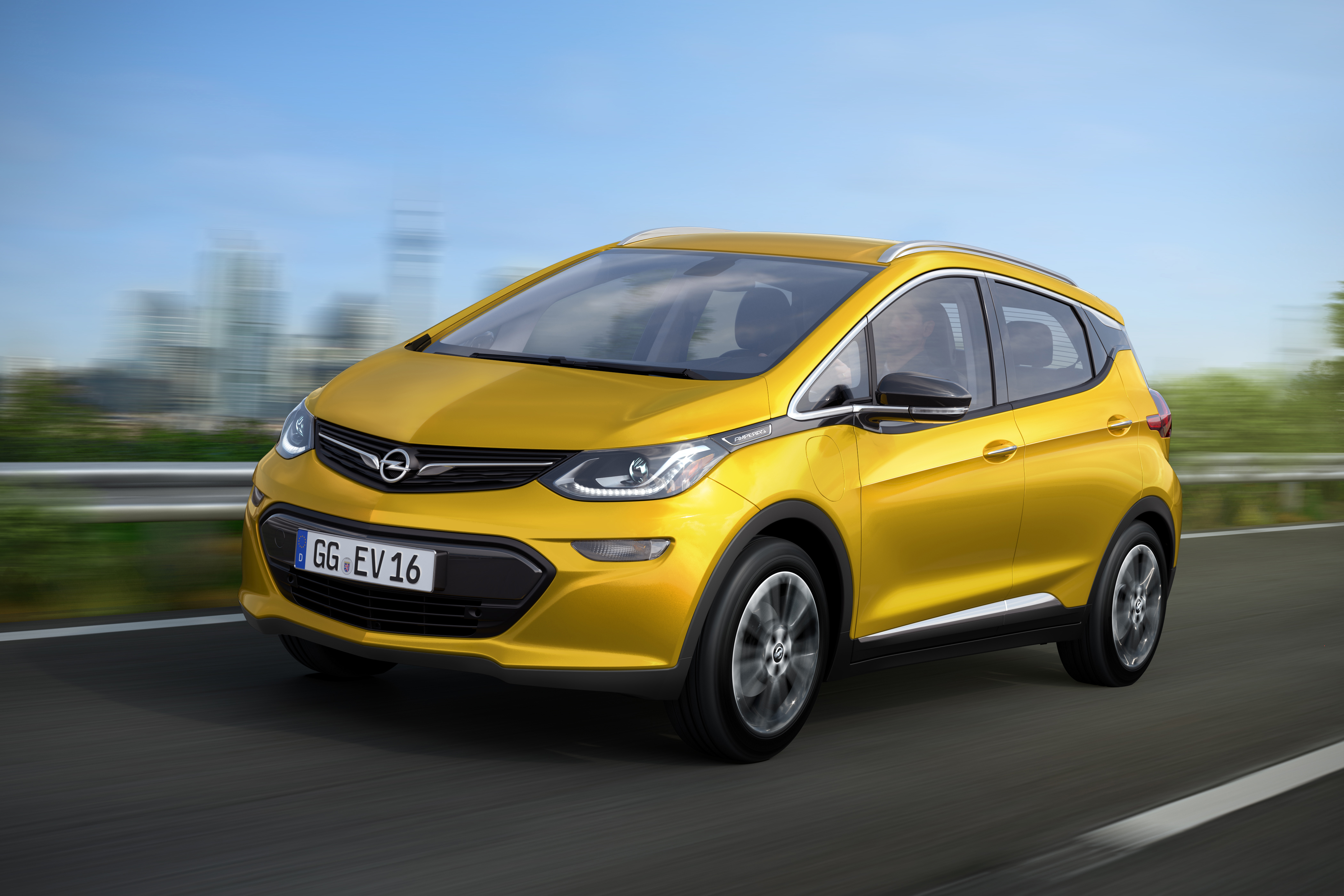 A yellow 2017 Opel Ampera-e on the road.