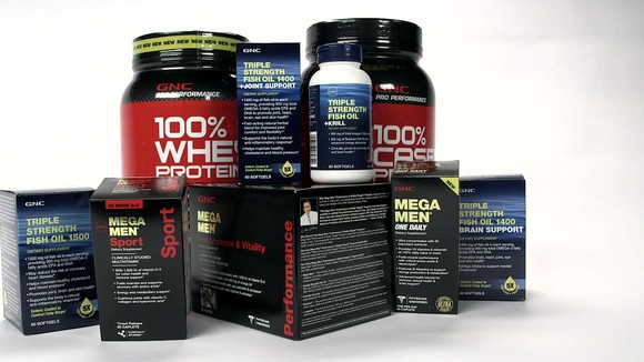 An assortment of GNC-branded products.
