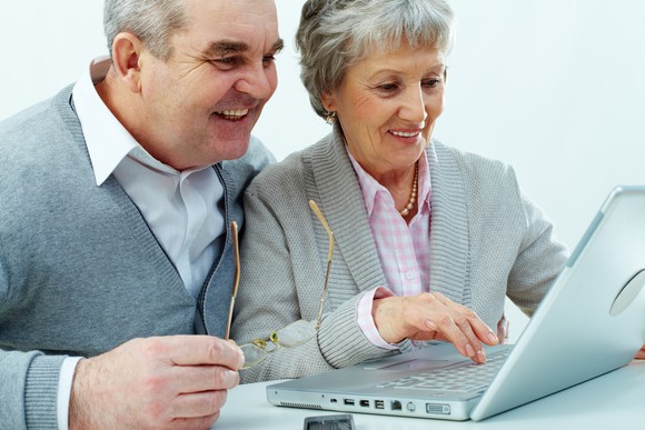 Seniors working at a laptop
