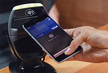Customer making a purchase with their Visa via a smartphone app