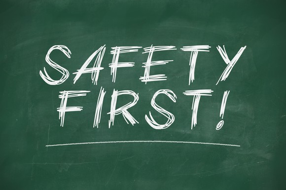 "safety first" written on chalk board