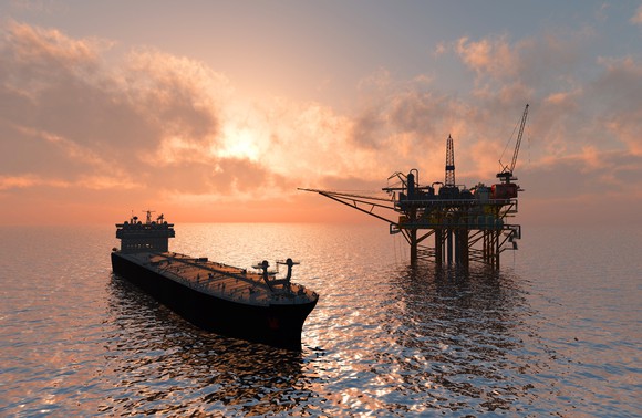 An oil tanker near an offshore oil platform.