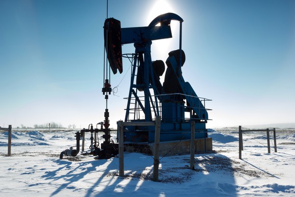 A Backlit Pump Jack in Alberta Canada.