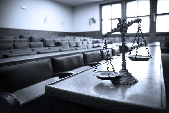 Justice scales in courtroom