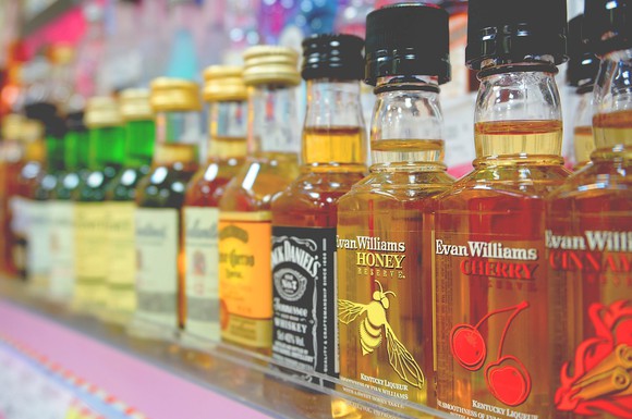 A line of miniature liquor bottles.