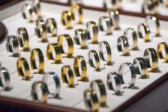 A bunch of silver and gold wedding bands.