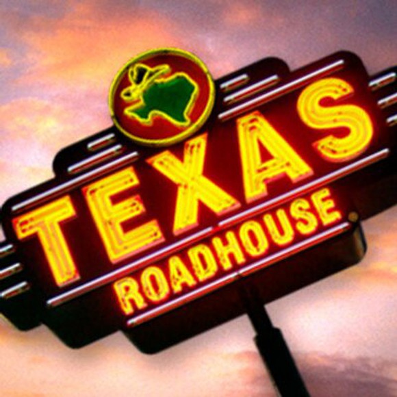 A neon Texas Roadhouse sign.