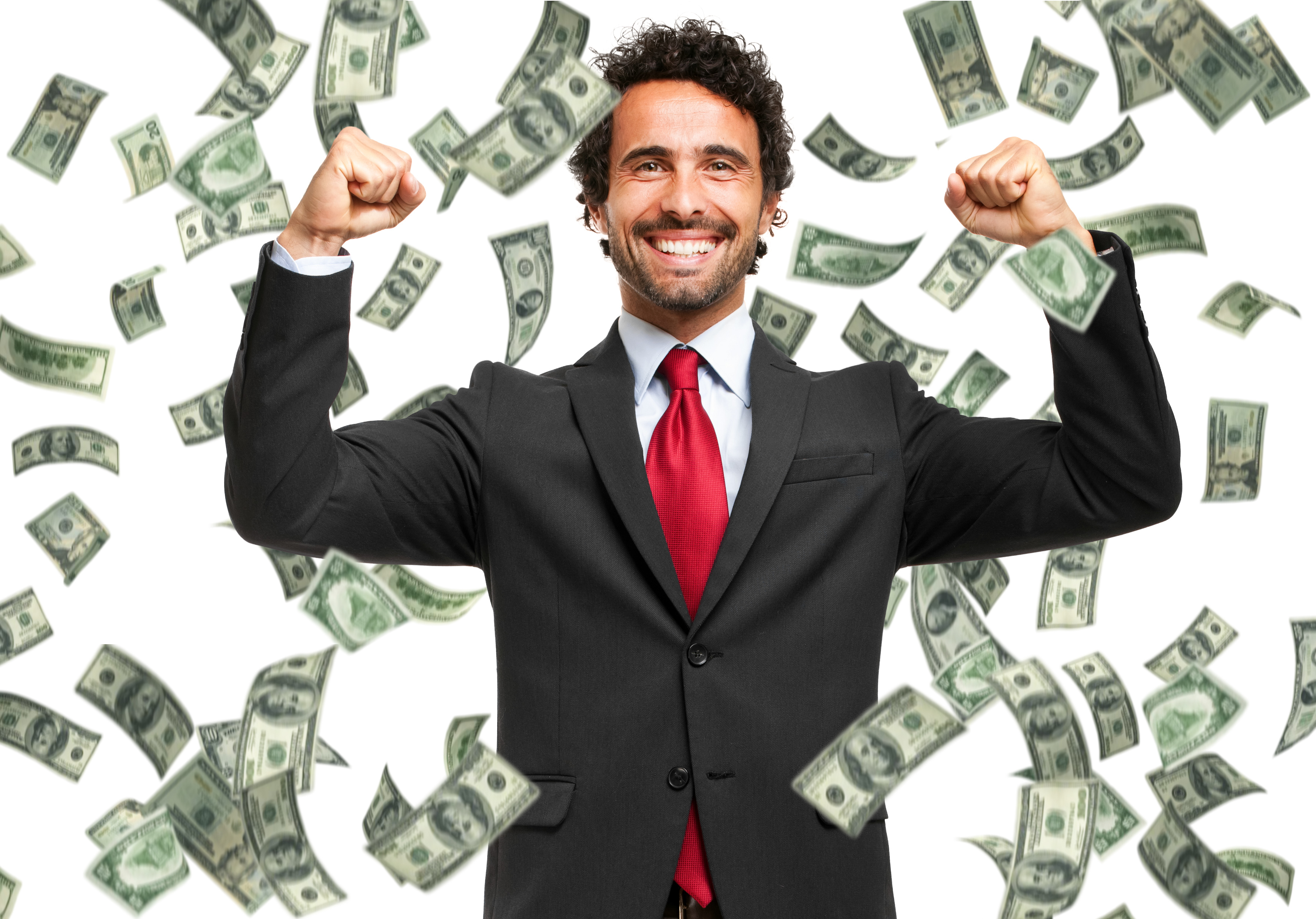 A businessman with arms raised stands as money falls down around him.
