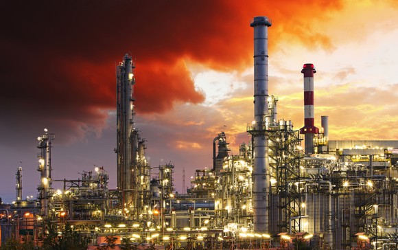Oil refinery under a red sky
