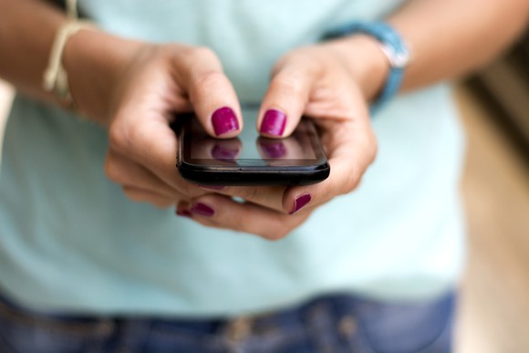 Woman holding phone in her hands
